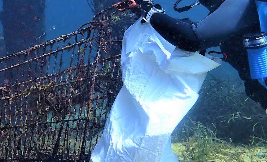 Volunteer divers clean up hidden trash to help end strain on sea life